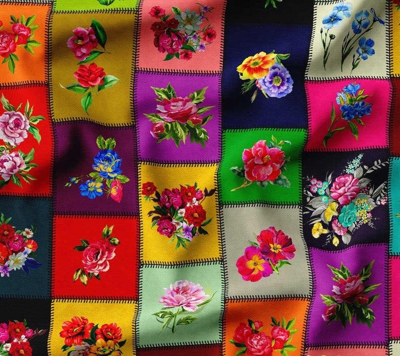 May include: A colorful patchwork quilt featuring squares of various colors, each adorned with a different floral arrangement. The flowers are in shades of red, pink, yellow, and blue, with green leaves. The squares are stitched together with black thread.