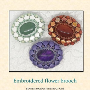 May include: Three embroidered flower brooches with different colored stones and beadwork. The brooches are green, purple, and orange.