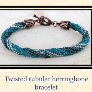 May include: A twisted tubular herringbone bracelet made with blue and green beads. The bracelet has a copper clasp.