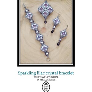 May include: A sparkling lilac crystal bracelet, pendant, and earrings set. The jewelry features a geometric design with lilac crystals and white beads. The set includes a bracelet, a pendant on a white cord, and a pair of earrings.