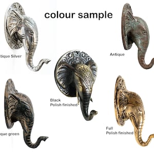 May include: Elephant head wall hook in five different finishes: antique silver, antique, antique green, black polish finished, and full polish finished. The hook is made of metal and has a detailed design.