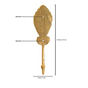 May include: Gold leaf-shaped wall hook with a 7.5 inch / 19 cm length and a 2 inch / 5 cm width.