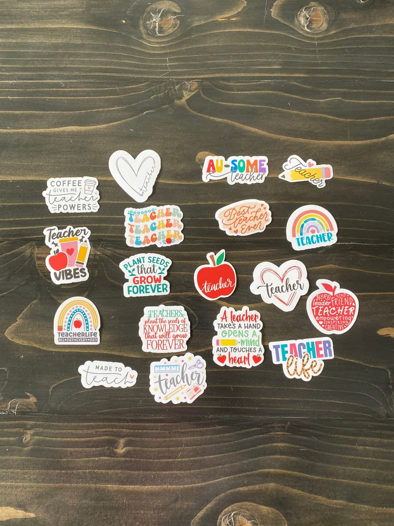 May include: A collection of 14 colorful teacher-themed stickers with various sayings and designs. The stickers feature phrases like "Teacher Vibes", "Teacher Life", "Made to Teach", "Plant Seeds that Grow Forever", "A Teacher Takes a Hand Opens a Mind and Touches a Heart", and "Teacher Like".