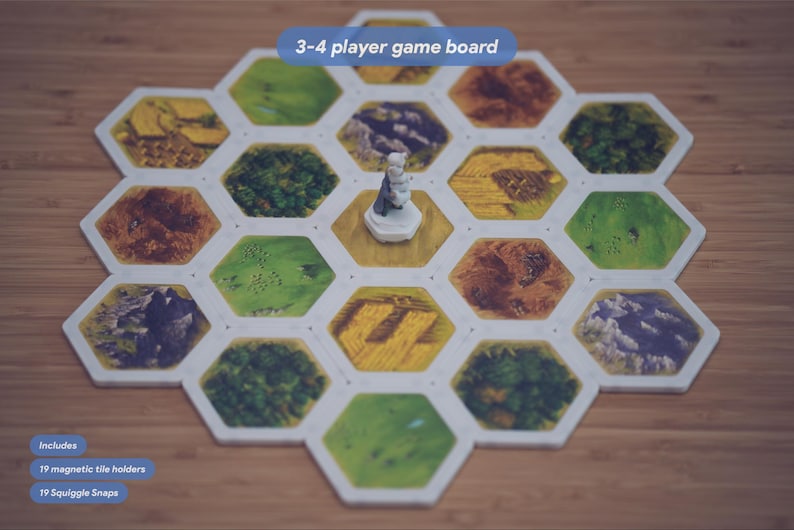 May include: A hexagonal 3-4 player game board featuring various terrain tiles including green fields, brown mountains, and forests. A small white figurine stands on a central tile. Text on the image reads 3-4 player game board, Includes 19 magnetic tile holders, and 19 Squiggle Snaps.