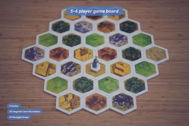 May include: A hexagonal 5-6 player game board featuring various terrain tiles including green fields, brown mountains, and yellow wheat fields. A small gray figurine stands in the center. Text on the image reads 5-6 player game board, Includes 30 magnetic land tile holders, and 30 Squiggle Snaps.