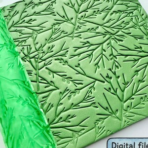 May include: A bright green cylindrical rolling pin and a matching square flat sheet, both featuring a deeply embossed pattern of delicate, thin branches with small leaves. A small blue rectangular sign displays the text Digital files for 3D printing.