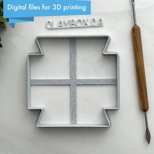 May include: A white plastic mold with a grid pattern, designed for 3D printing. The mold is labeled "CLAYBOX.CA" and is shown with a small tool.