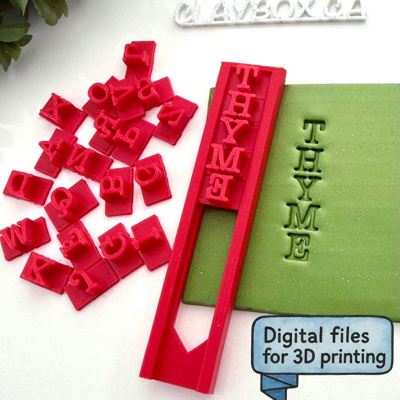 May include: A red stamp set with individual letter stamps and a frame spelling "THYME". The letters are pressed into a green surface, with the text "Digital files for 3D printing" in a blue banner.