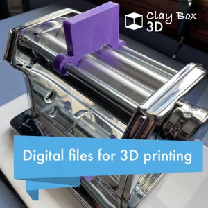 May include: A silver metal pasta maker with a purple plastic attachment. The text "Clay Box 3D" is visible in the upper right corner of the image. The text "Digital files for 3D printing" is visible in the lower part of the image.