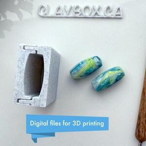 May include: A white 3D printed mould for making small, cylindrical beads. Two blue, green and white marbled beads are shown next to the mould. The text "Digital files for 3D printing" is displayed below the mould.