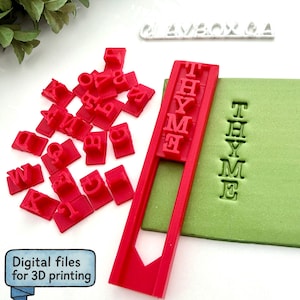 May include: Red 3D-printed letter stamps and a stamp holder are displayed next to a green block with the word "THYME" imprinted. A collection of individual red letters is scattered nearby. The text "Digital files for 3D printing" is in a blue box.