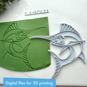 May include: A gray plastic marlin-shaped cookie cutter next to a green clay impression of the same design. The text "Digital files for 3D printing" is in a blue rectangle at the bottom. The @AVBOX GA logo is at the top.