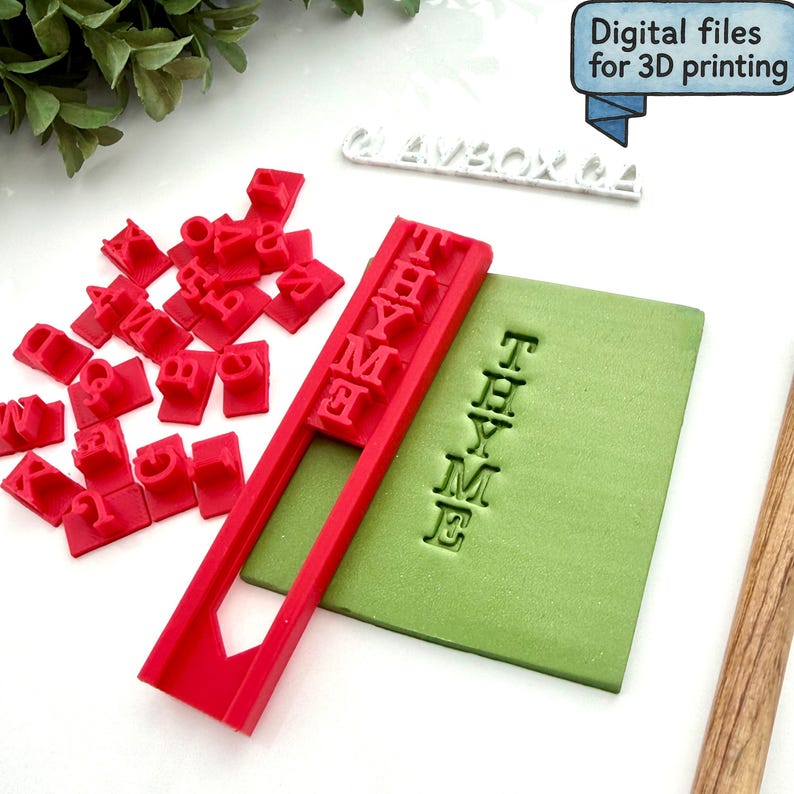 May include: A red letter stamp set with individual letters and a frame, alongside a green rectangular block with the word "THYME" stamped into it. The image also includes the text "Digital files for 3D printing".