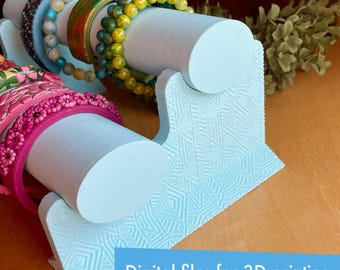 May include: A light blue, 3D printed jewelry stand with two cylindrical rods for holding bracelets. The stand has a geometric pattern and is designed for displaying bracelets.