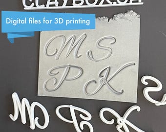 May include: White plastic letters M, P, K, and 2 in a cursive font. The letters are 3D printed and are shown next to a sheet of paper with the same letters printed in a gray color. The paper has the text "CLAYBOX.CA" and "Digital files for 3D printing" printed on it.