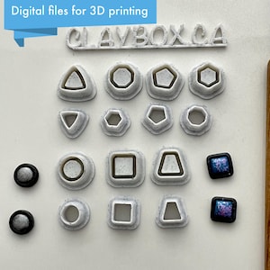 May include: A set of 3D printed plastic molds for making clay jewelry. The molds are in various shapes, including circles, squares, triangles, and pentagons. There are also two small, black and silver, 3D printed pieces.
