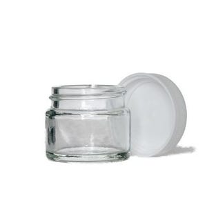 Op de afbeelding: Een kleine, heldere glazen pot met een witte schroefdop. De pot is cilindrisch met een brede opening. De dop ligt naast de pot. Geschikt voor het bewaren van kleine hoeveelheden.