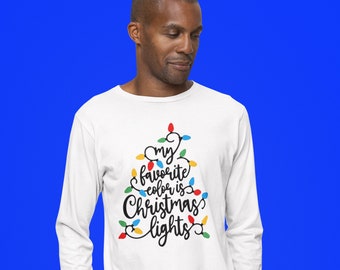 May include: A white long-sleeve shirt featuring a graphic of black cursive text that reads, My favorite color is Christmas lights, arranged in a triangular shape and decorated with small, colorful light bulb illustrations in red, blue, green, and yellow.