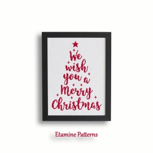 Puede incluir: Un patrón de punto de cruz enmarcado con una estrella roja y el texto "We wish you a Merry Christmas" en una fuente cursiva roja.