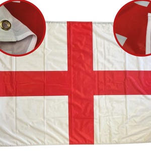 May include: A white flag featuring the red cross of Saint George, the flag of England. The flag has a white background with a red cross. The flag has eyelets for hanging.