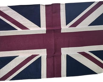 May include: A Union Jack flag with a white background, red crosses, and blue borders. The flag is made of a soft, textured fabric.
