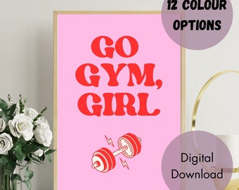 May include: A pink printable poster with the text "GO GYM, GIRL" in red letters. A red dumbbell with lightning bolts is below the text. The poster is framed in a light wood frame.