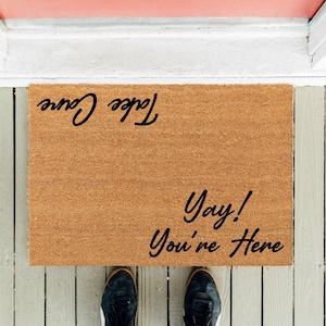 Funny Welcome Doormat: &quot;Yay! You&#39;re Here - Take Care&quot;