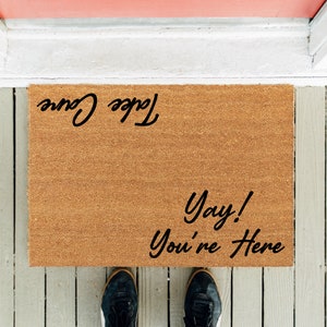 Funny Welcome Doormat: &quot;Yay! You&#39;re Here - Take Care&quot;