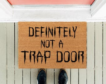 Paillasson D&D : un tapis de bienvenue amusant « Certainement pas une trappe »