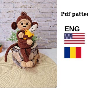 Puede incluir: Patrón de crochet para un mono sosteniendo un plátano. El patrón está disponible en inglés y rumano. El patrón es una descarga PDF.