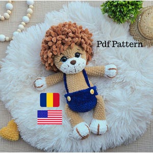 May include: A handmade crochet lion toy with a brown mane, tan body, and blue overalls. The lion has white accents on its paws and face. The image includes the text "Pdf Pattern" and flags of Romania and the United States.