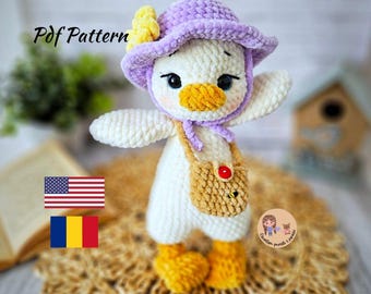 May include: Crochet amigurumi pattern for a white duck with a purple and yellow hat and a brown bag. The pattern is available in English and Romanian.