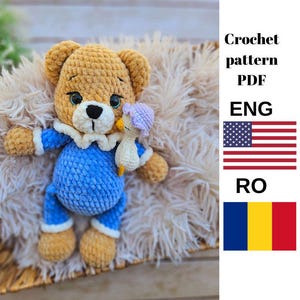 May include: Crochet pattern PDF in English and Romanian for a brown teddy bear wearing a blue onesie and holding a small crocheted duckling.