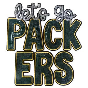 May include: A sequined patch with the words "let's go PACKERS" in green and gold. The words "let's go" are in silver sequins. The letters of "PACKERS" are in dark green sequins with gold trim.