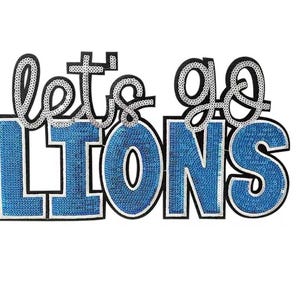 May include: A sequined applique with the words "let's go LIONS" in a playful font. The letters "let's" and "go" are outlined in silver sequins, while "LIONS" is filled with blue sequins. The design has a black border and is set against a white background.