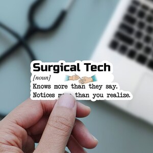 May include: A white sticker with the text "Surgical Tech" and a definition. The definition reads "Knows more than they say. Notices more than you realize." A stethoscope, laptop, and notepad are in the background.