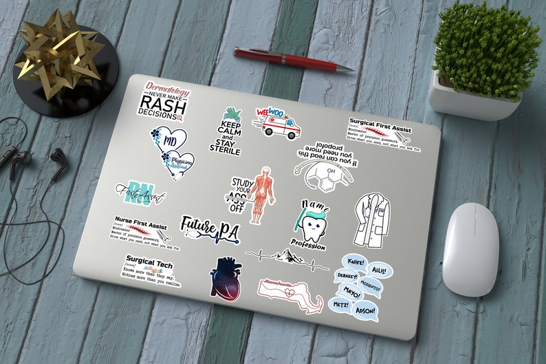 May include: A laptop computer covered in stickers with various medical professions and sayings. The stickers are in blue, green, pink, and white. The stickers include "Dermatology Never Make Rash Decisions", "Keep Calm and Stay Sterile", "Future PA", "Nurse First Assist", "Surgical Tech", "Surgical First Assist", "I am a Profession", and more.