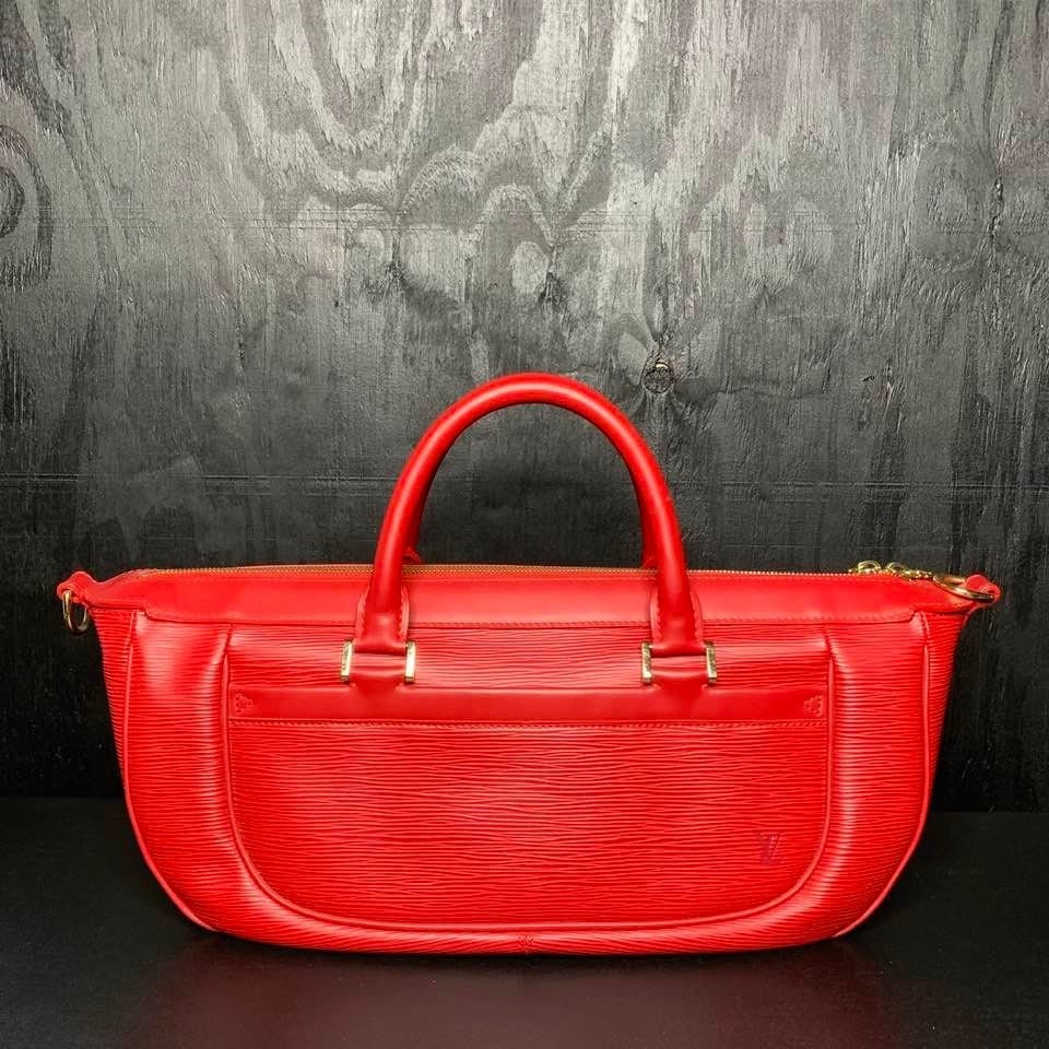 Louis Vuitton Castilian Red Epi Leather Pochette - The Palm Beach Trunk  Designer Resale and Luxury Consignment