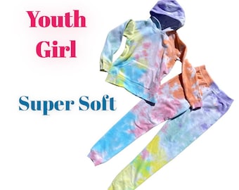 May include: A tie-dye hoodie and sweatpants set in shades of blue, yellow, pink, and orange. The set is made of soft, comfortable fabric and is perfect for casual wear.