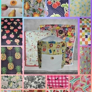 May include: A collection of fabric swatches with various fruit and floral patterns. Designs include pears, cherries, apples, pineapples, and floral arrangements. A central item is a yellow and white appliance cover with a white pocket.