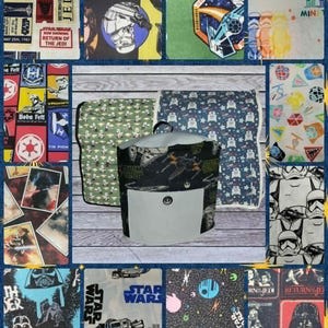 May include: A collage of Star Wars-themed fabric squares and a cylindrical container. The fabrics feature characters, logos, and text from the Star Wars franchise. Colors include blue, green, red, and white. The container has a white pocket and a black design.