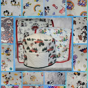 May include: A collection of fabric covers featuring various Disney character prints, including Mickey and Minnie Mouse in seasonal themes like Halloween, Christmas, and rainbow patterns. The central item is a quilted appliance cover with a red truck print.