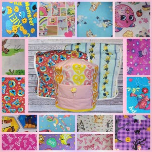 May include: A collection of fabric swatches featuring various cartoon characters and patterns, including Cookie Monster, Bluey, Shopkins, Minions, Peppa Pig, and Barbie, surrounding a central quilted fabric cover with a pink pocket and lollipop.
