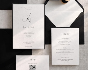 May include: Elegant wedding invitation suite featuring a black and white color scheme. The invitation includes the names "Ivory & Noah" and event details. The suite includes an RSVP card, details card, and black envelopes.