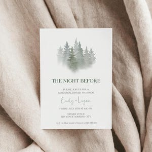 May include: A watercolor illustration of a forest with a white background. The text "THE NIGHT BEFORE" is at the top of the card. The text "PLEASE JOIN US FOR A REHEARSAL DINNER TO HONOR Emily + Logan FRIDAY, JULY 13TH AT 6:30 PM DINNER VENUE 1234 VENUE ADDRESS, CITY rsvp to Blair maid of honor at 123-345-2834" is printed below the illustration.