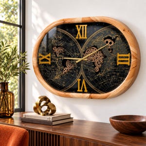 May include: An oval wall clock with a light wood frame features a black world map background with gold Roman numerals. The clock face displays exposed mechanical gears integrated into the map design, with gold hands indicating the time.