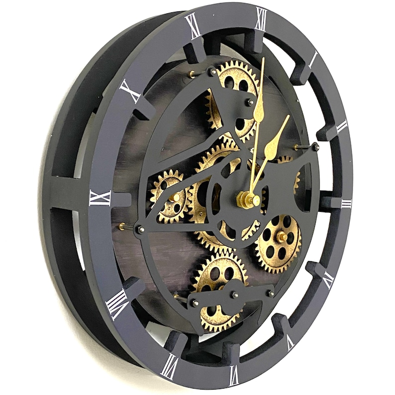 May include: Black clock with Roman numeral markings and gold gears. The clock face is a dark wood with a visible grain pattern.
