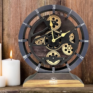 May include: A black and gold clock with a gear design. The clock has Roman numerals and is on a wooden base with the text "Improving Life" on it.