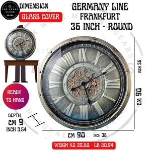 May include: A round, silver-toned wall clock with Roman numerals and visible gears. The clock face is 36 inches in diameter and 3.54 inches deep. The clock is ready to hang.