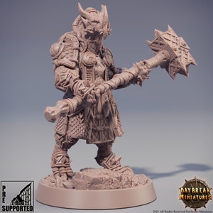May include: A pre-supported 3D printed miniature of a fantasy warrior with a dragon-like head, wearing chainmail armor and holding a spiked hammer. The miniature is painted in a light brown color.